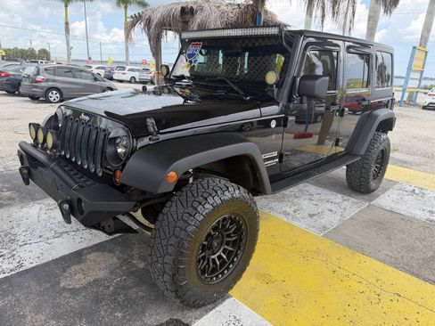 Used 2013 Jeep Wrangler Unlimited Sport AWD/4WD image 1