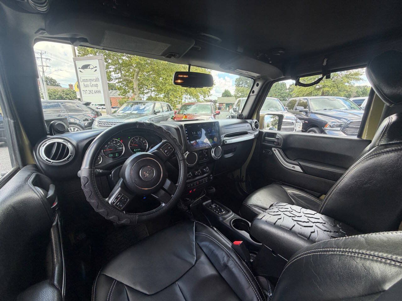 Used 2013 Jeep Wrangler Unlimited Sahara w/ Dual Top Group AWD/4WD image 14