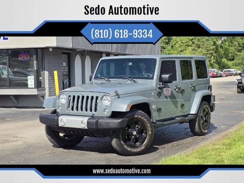 Used 2014 Jeep Wrangler Unlimited Sahara w/ Dual Top Group AWD/4WD image 1
