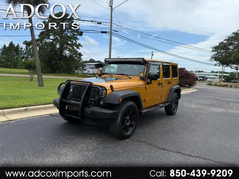 Used 2014 Jeep Wrangler Unlimited Sahara AWD/4WD image 1
