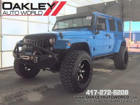 Used 2015 Jeep Wrangler Unlimited Sahara w/ Max Tow Package AWD/4WD image 1