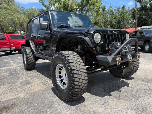 Used 2012 Jeep Wrangler Unlimited Sahara w/ Mopar Chrome Edition Group AWD/4WD image 1