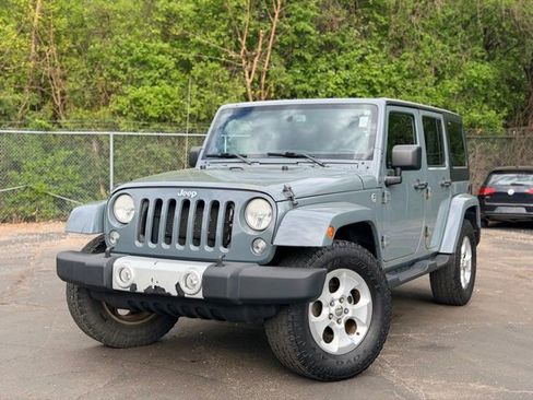 Used 2014 Jeep Wrangler Unlimited Sahara w/ Dual Top Group AWD/4WD image 1