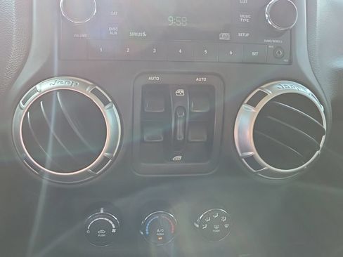 Used 2012 Jeep Wrangler Unlimited Sahara w/ Dual Top Group AWD/4WD image 13
