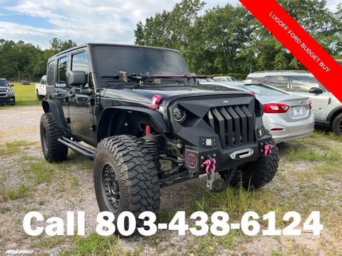 Used 2013 Jeep Wrangler Unlimited Sport AWD/4WD image 1