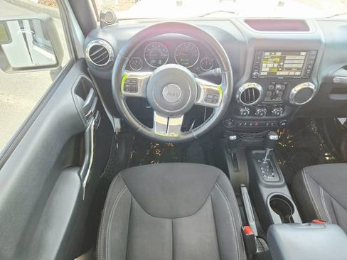Used 2014 Jeep Wrangler Unlimited Sahara w/ Dual Top Group AWD/4WD image 11