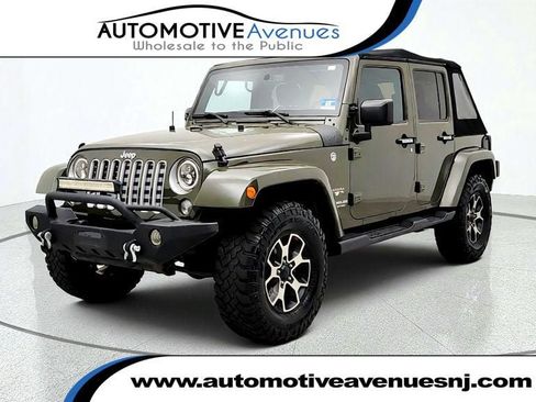 Used 2016 Jeep Wrangler Unlimited Sahara w/ Dual Top Group AWD/4WD image 1