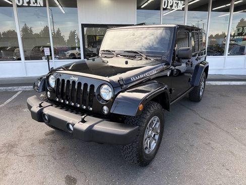 Used 2015 Jeep Wrangler Unlimited Rubicon w/ Dual Top Group AWD/4WD image 1