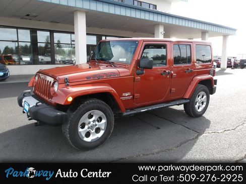 Used 2014 Jeep Wrangler Unlimited Sahara w/ Mopar Chrome Edition Group AWD/4WD image 1