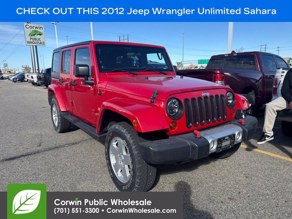 Used 2012 Jeep Wrangler Unlimited Sahara w/ Dual Top Group AWD/4WD image 1