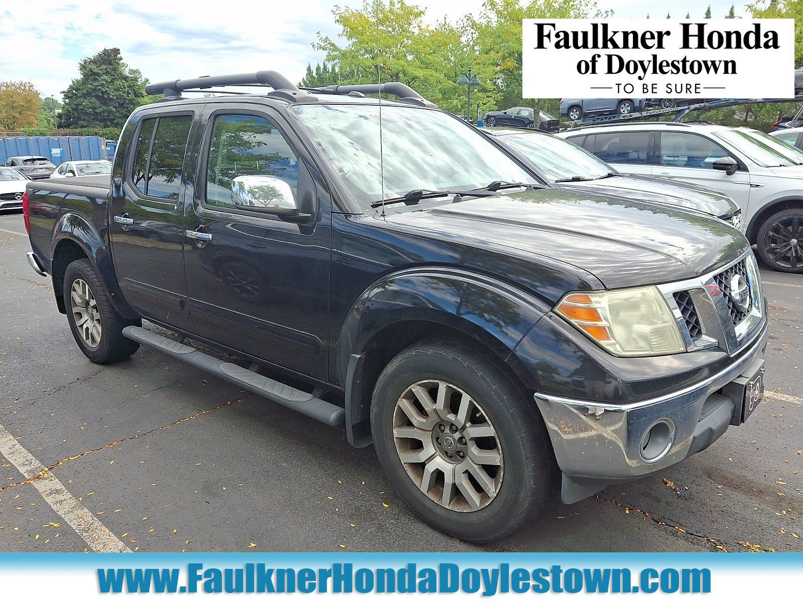 Used 2011 Nissan Frontier SL AWD/4WD image 1