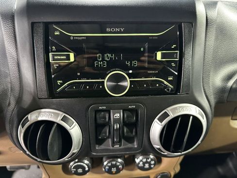 Used 2012 Jeep Wrangler Unlimited Sahara w/ Dual Top Group AWD/4WD image 14