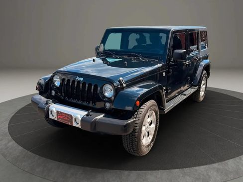 Used 2014 Jeep Wrangler Unlimited Sahara w/ Dual Top Group AWD/4WD image 1