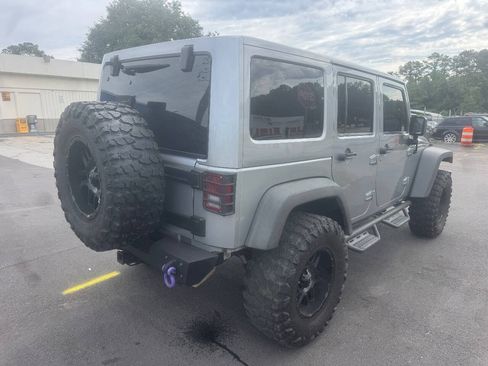 Used 2014 Jeep Wrangler Unlimited Rubicon w/ Dual Top Group AWD/4WD image 6