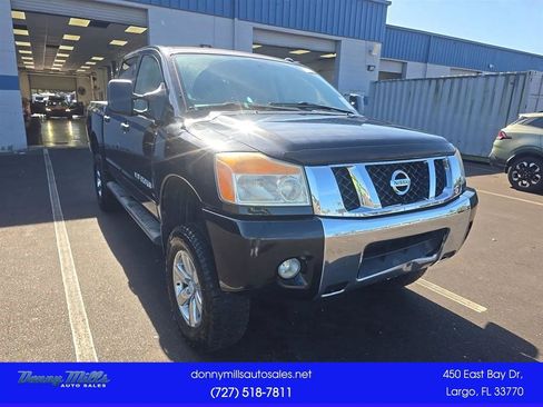 Used 2013 Nissan Titan SV w/ SV Premium Utility Pkg AWD/4WD image 1