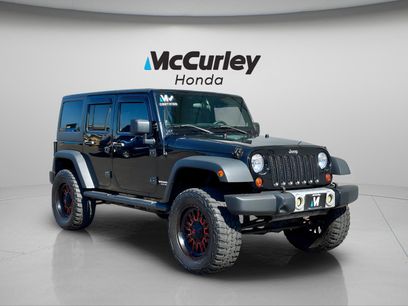 Used 2012 Jeep Wrangler Unlimited Sport w/ Black Appearance Group