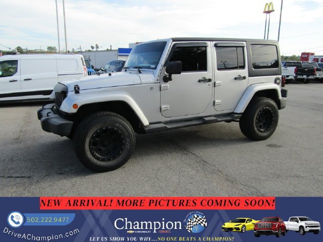 Used 2012 Jeep Wrangler Unlimited Sahara w/ Dual Top Group AWD/4WD image 1