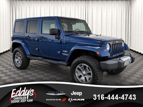 Used 2010 Jeep Wrangler Unlimited Sahara w/ Dual Top Group AWD/4WD image 1