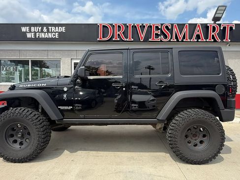 Used 2014 Jeep Wrangler Unlimited Rubicon w/ Dual Top Group AWD/4WD image 5