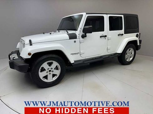 Used 2013 Jeep Wrangler Unlimited Sahara w/ Dual Top Group AWD/4WD image 1