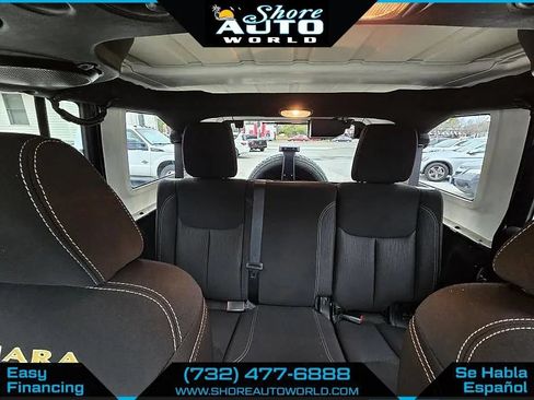 Used 2014 Jeep Wrangler Unlimited Sahara w/ Dual Top Group AWD/4WD image 16