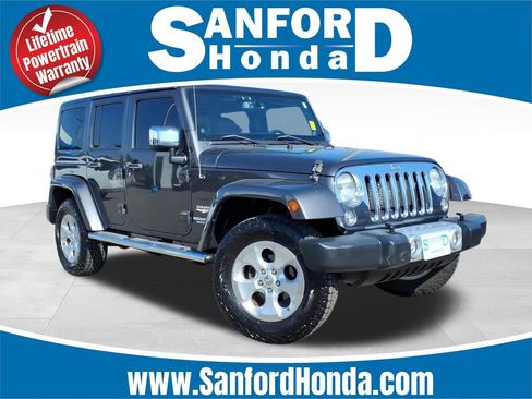 Used 2014 Jeep Wrangler Unlimited Sahara w/ Mopar Chrome Edition Group AWD/4WD image 1