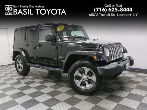 Used 2016 Jeep Wrangler Unlimited Sahara w/ Dual Top Group AWD/4WD image 1