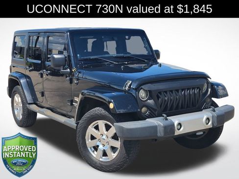 Used 2012 Jeep Wrangler Unlimited Sahara w/ Dual Top Group AWD/4WD image 1