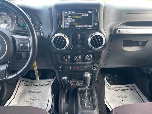 Used 2014 Jeep Wrangler Unlimited Sahara w/ Dual Top Group AWD/4WD image 24