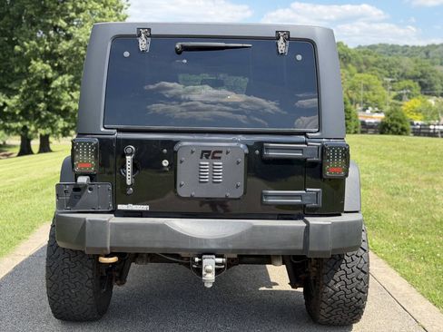 Used 2014 Jeep Wrangler Unlimited Rubicon w/ Dual Top Group AWD/4WD image 11