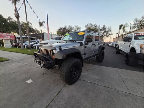 Used 2013 Jeep Wrangler Unlimited Sport w/ PWR Convenience Group AWD/4WD image 1
