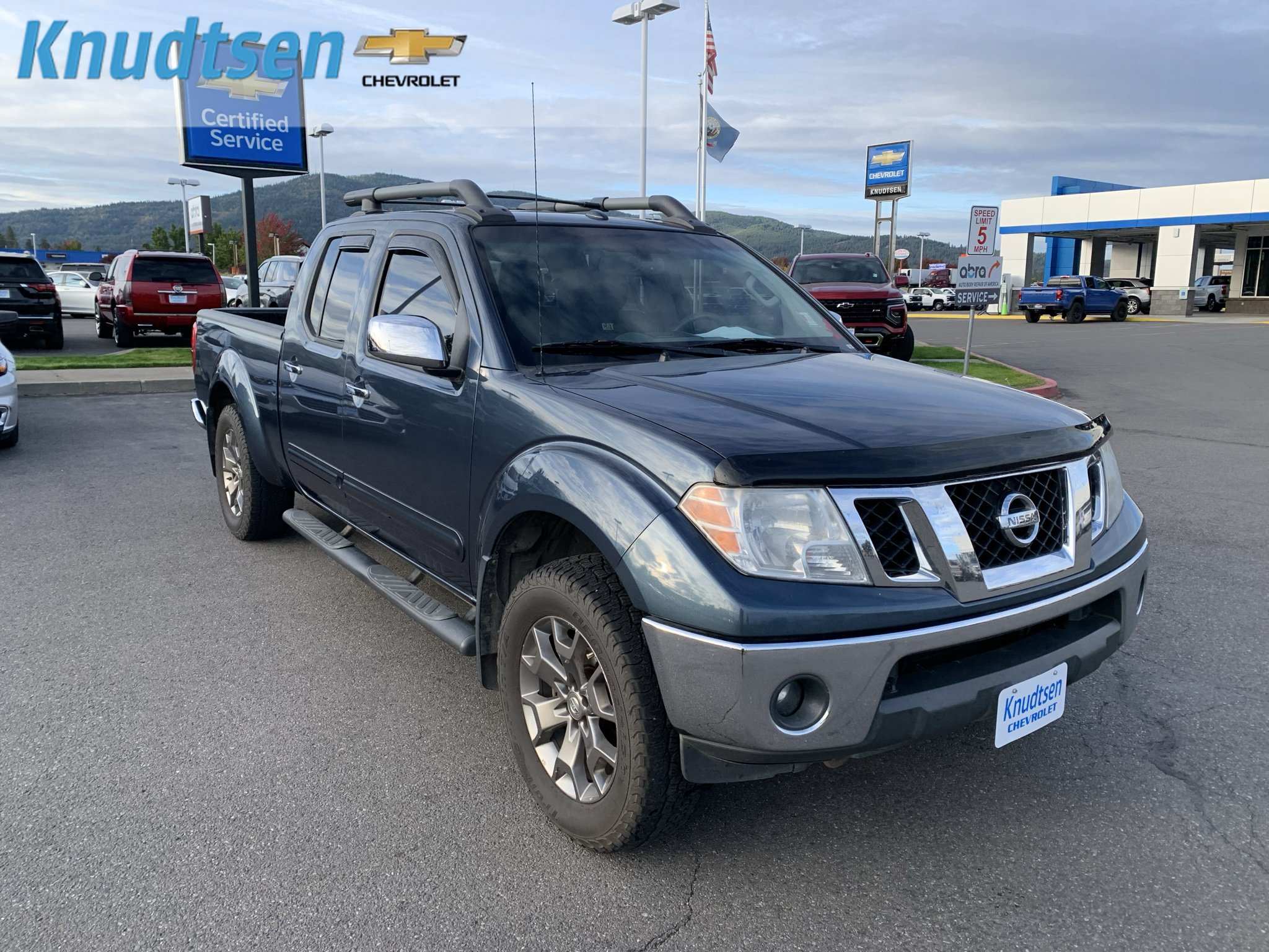 Used 2014 Nissan Frontier SL AWD/4WD image 1