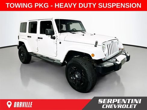 Used 2013 Jeep Wrangler Unlimited Sahara AWD/4WD image 1