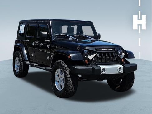 Used 2010 Jeep Wrangler Unlimited Sahara w/ Dual Top Group AWD/4WD image 1