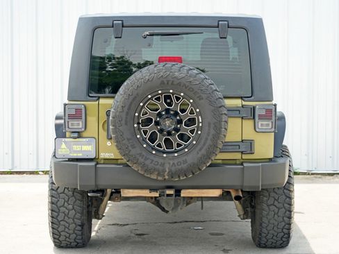 Used 2013 Jeep Wrangler Unlimited Sport w/ Mopar Black Appearance Group image 10