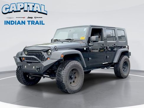Used 2010 Jeep Wrangler Unlimited Sport w/ Mopar Chrome Edition Group AWD/4WD image 1