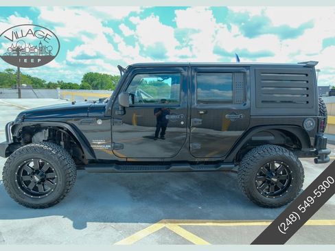 Used 2012 Jeep Wrangler Unlimited Sahara AWD/4WD image 1