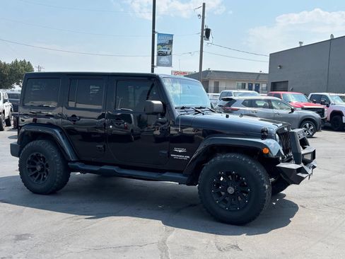 Used 2014 Jeep Wrangler Unlimited Sahara AWD/4WD image 1
