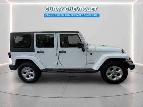 Used 2014 Jeep Wrangler Unlimited Sahara w/ Dual Top Group AWD/4WD image 14