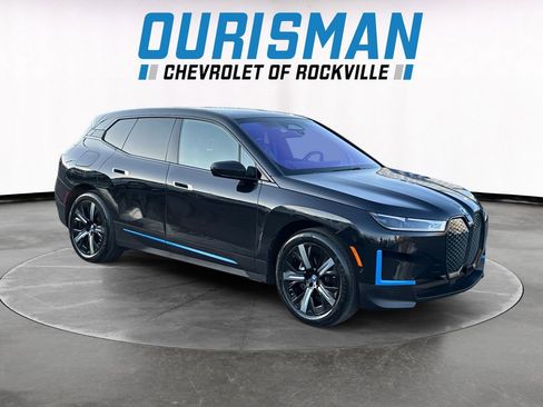 Used 2023 BMW iX xDrive50 w/ BMW I Signature Blue Package image 1