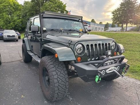 Used 2012 Jeep Wrangler Unlimited Sahara w/ Trailer Tow Group AWD/4WD image 1