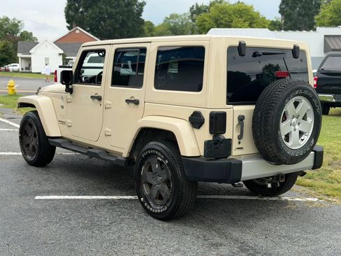 Used 2012 Jeep Wrangler Unlimited Sahara w/ Dual Top Group AWD/4WD image 7