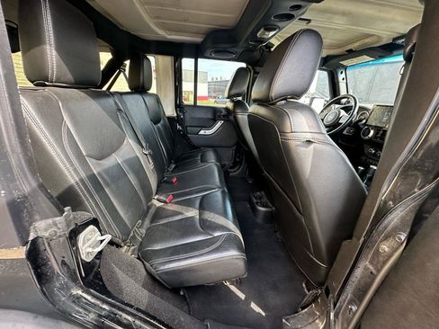 Used 2013 Jeep Wrangler Unlimited Sahara w/ Dual Top Group AWD/4WD image 12