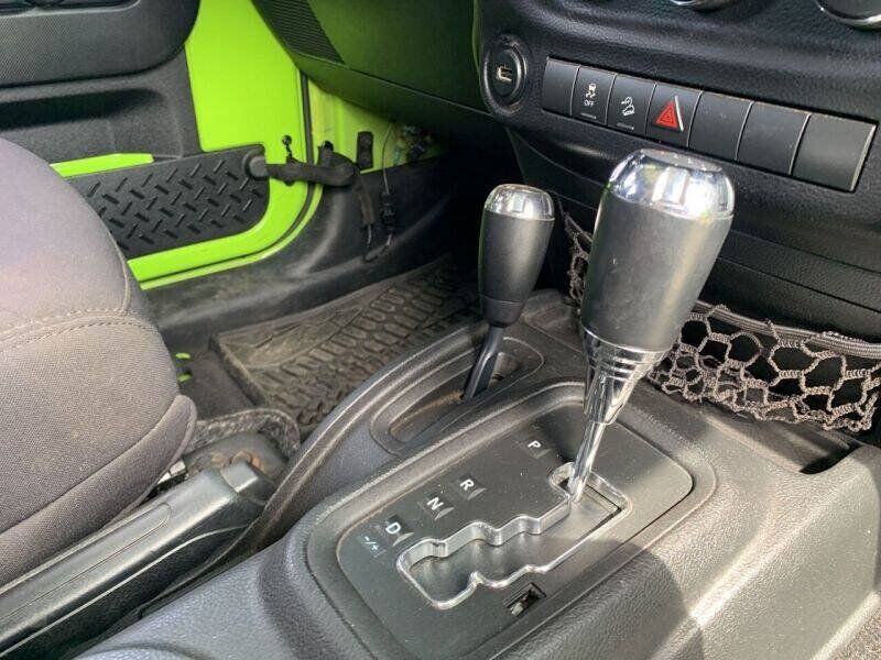 Used 2013 Jeep Wrangler Unlimited Sport w/ Mopar Black Appearance Group AWD/4WD image 11
