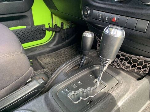 Used 2013 Jeep Wrangler Unlimited Sport w/ Mopar Black Appearance Group AWD/4WD image 11