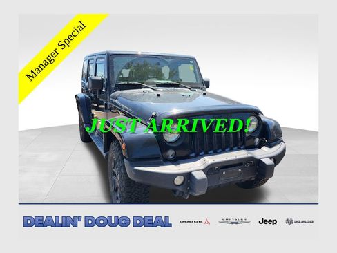 Used 2016 Jeep Wrangler Unlimited Sahara AWD/4WD image 1