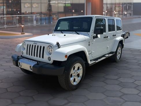 Used 2015 Jeep Wrangler Unlimited Sahara w/ Mopar Chrome Edition Group AWD/4WD image 1