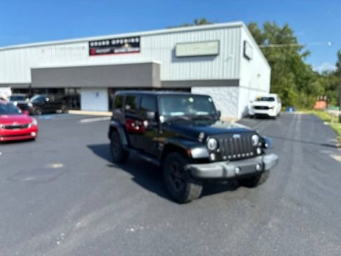 Used 2014 Jeep Wrangler Unlimited Sahara w/ Dual Top Group AWD/4WD image 1