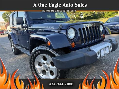 Used 2013 Jeep Wrangler Unlimited Sahara w/ Trailer Tow Group AWD/4WD image 1