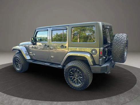 Used 2014 Jeep Wrangler Unlimited Sahara w/ Dual Top Group AWD/4WD image 12